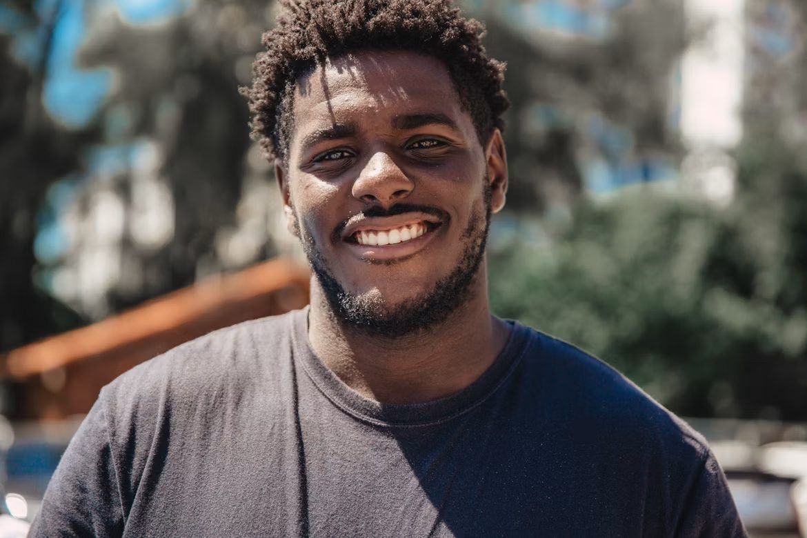 A smiling young man outdoors